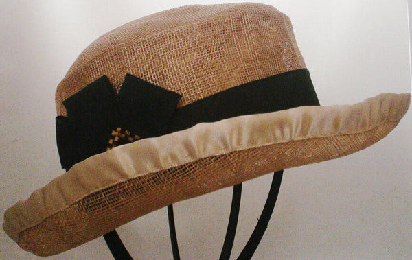 Tan Hat of Sinamay with 2 1/2" Brim Turned Up, Black Trim and Gold Lining